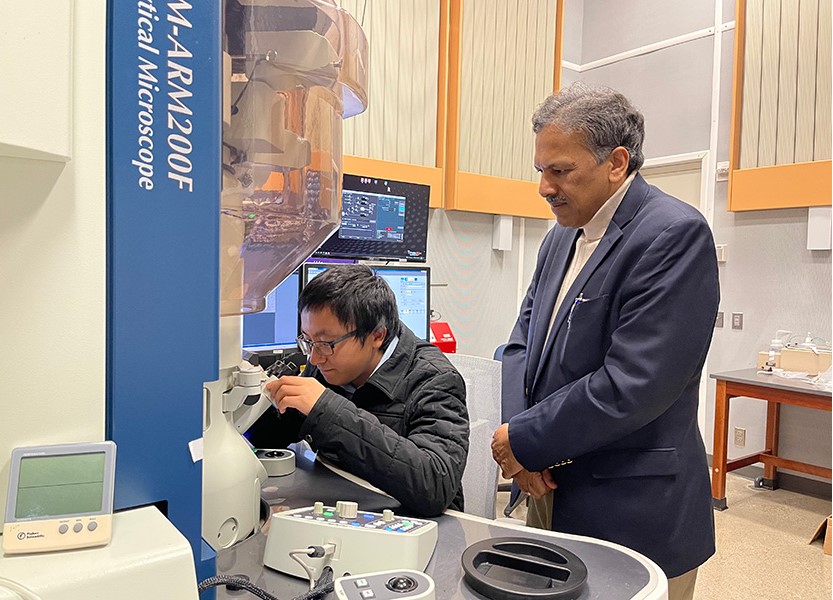 NUANCE Director Vinayak P Dravid with Xiaobing Hu, EPIC Facility manager examining samples